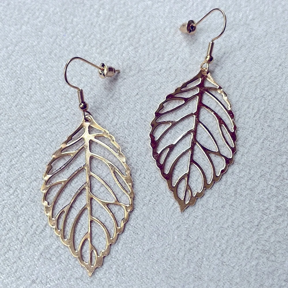Gold hollow leaf earrings